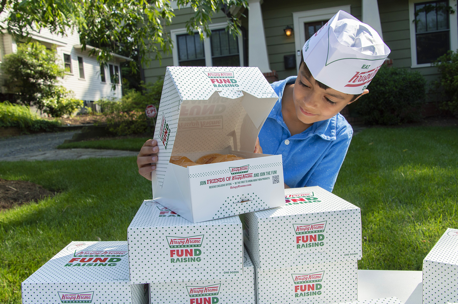 Boy with donuts in boxes