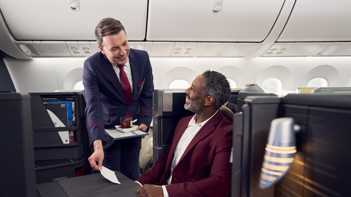 Flight attendant in aircraft cabin