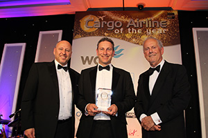 Best Cargo Airline in the Americas Award was presented by IATA's Glyn Hughes to Tristan Koch.