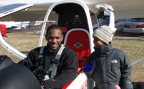 Keith Taylor, left, and his little brother are pictured following Keith’s discovery flight in 2014