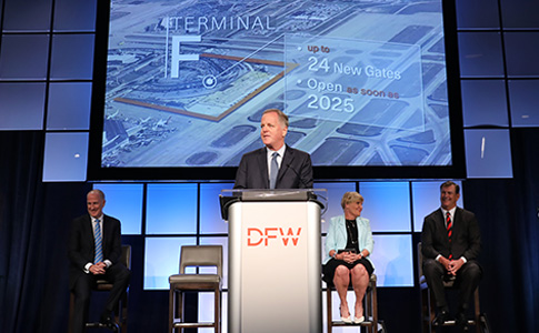 American CEO Doug Parker addresses the audience with (L to R) DFW Airport CEO Sean Donohue, Fort Worth Mayor Betsy Price and Dallas Mayor Mike Rawlings seated.