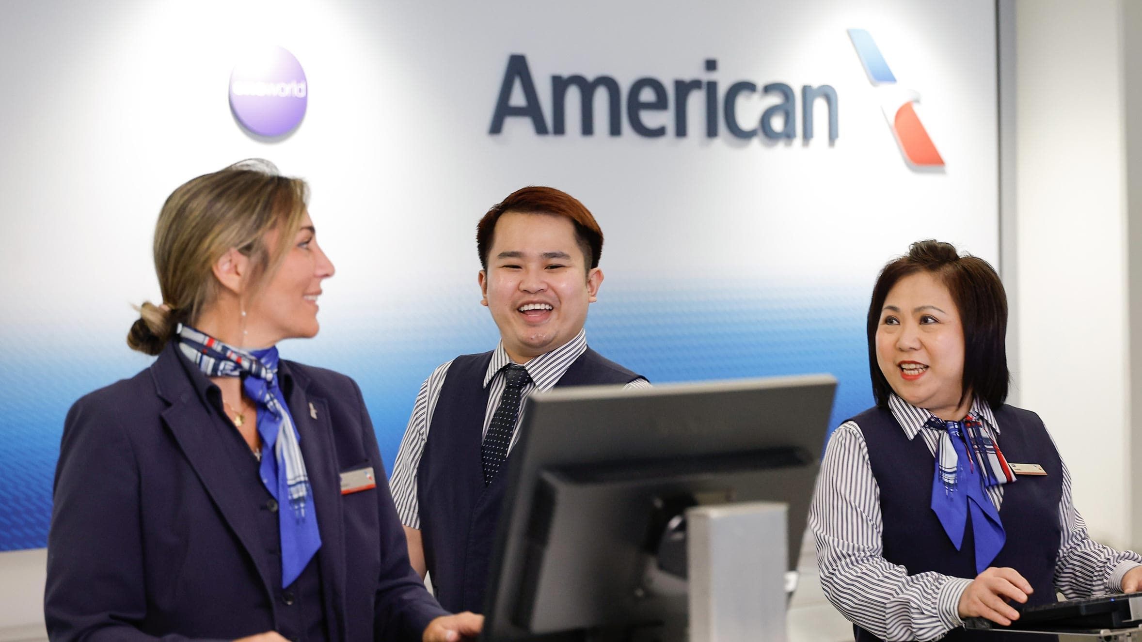 An American Airlines maintenance worker shakes hands with a pilot in a friendly, familiar way.